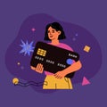 Young girl holds a big bank card. Modern secure electronic payment, transfer money